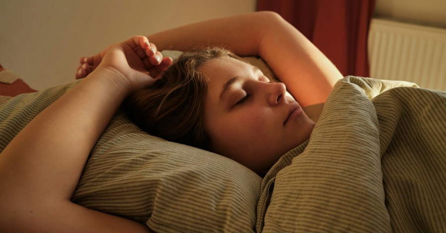 Girl sleeping on her back